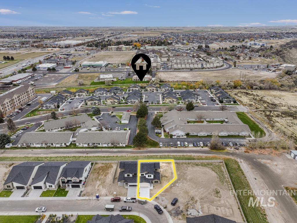 Aerial perspective of suburban area with property parcel outlined