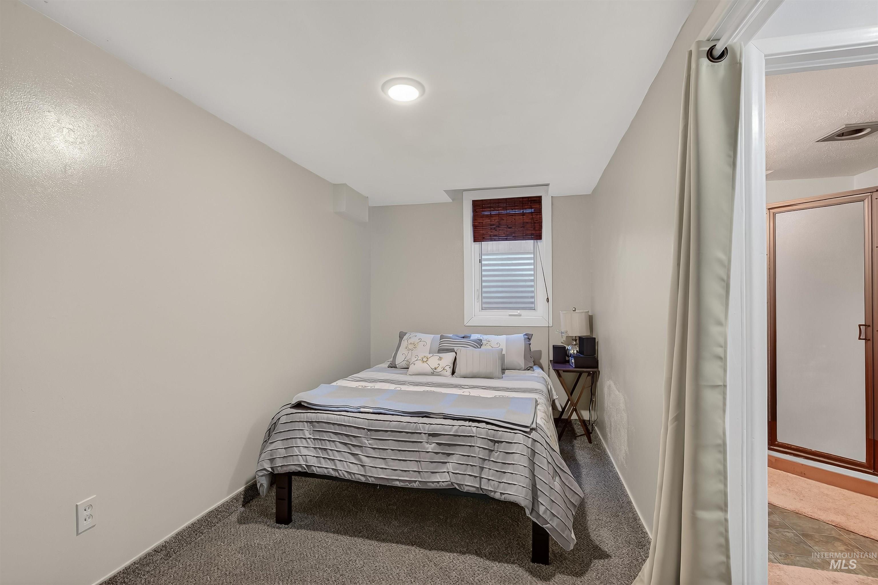Bedroom with carpet and baseboards