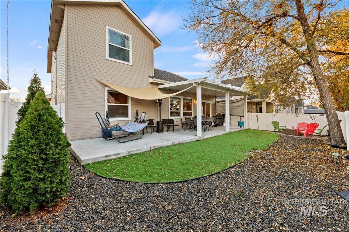 Back of house with a patio area