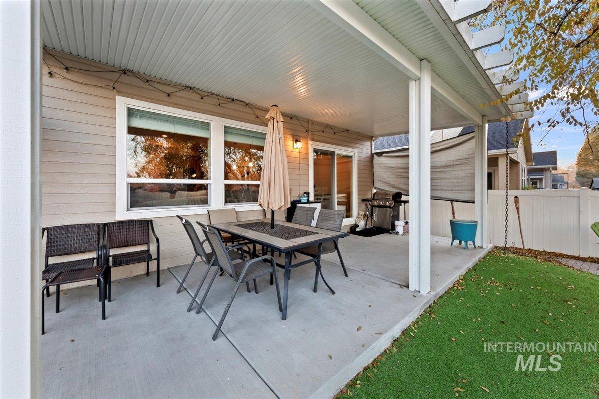 View of patio featuring outdoor dining space and grilling area