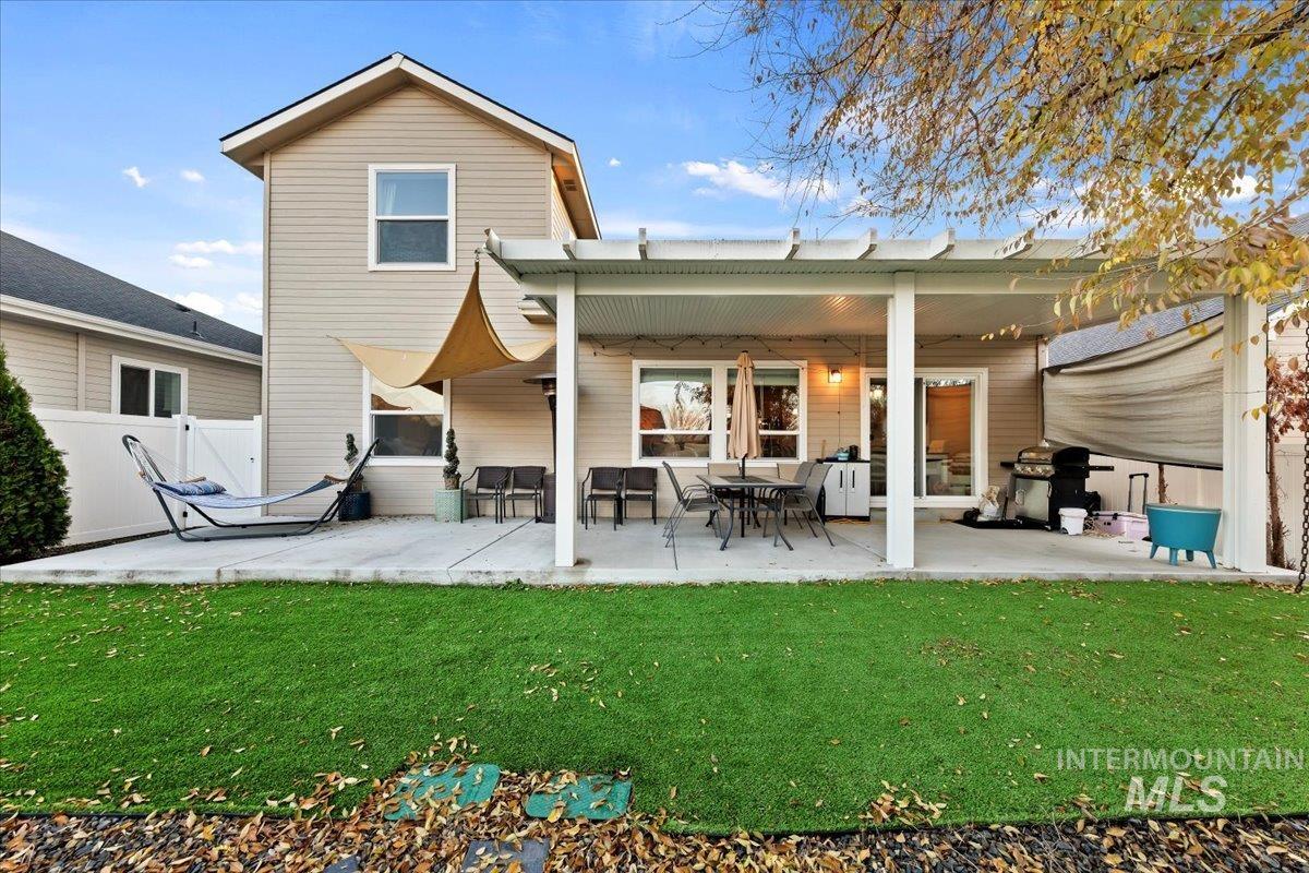 Back of property featuring a patio area