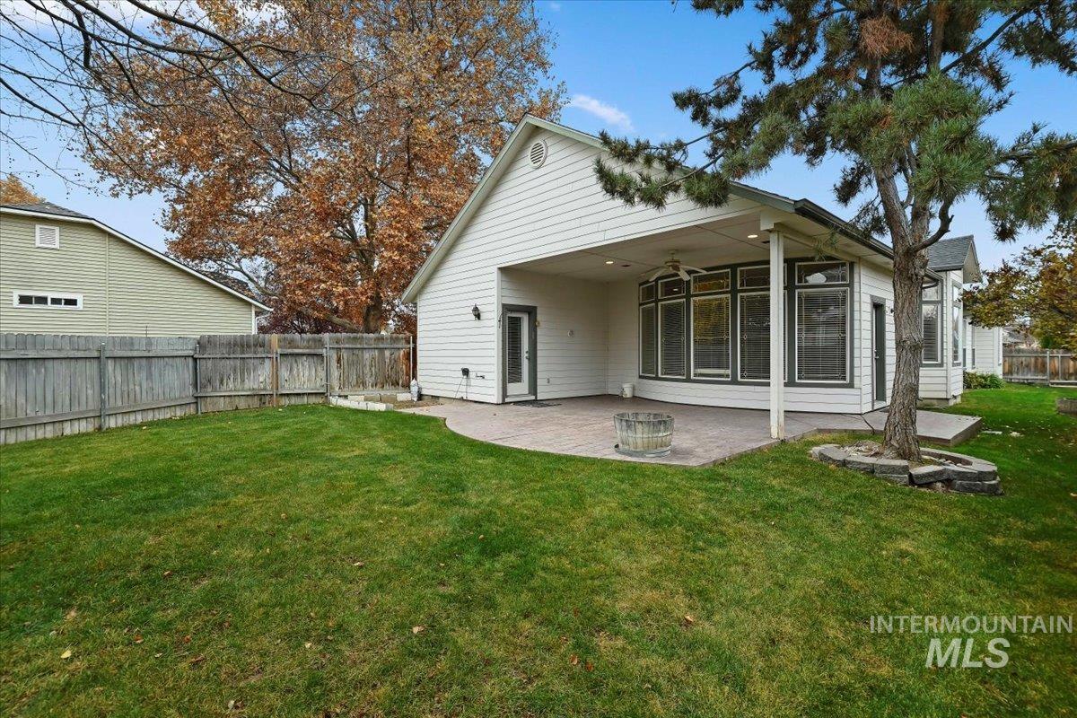Rear view of property with a patio, a fenced backyard, and ceiling fan
