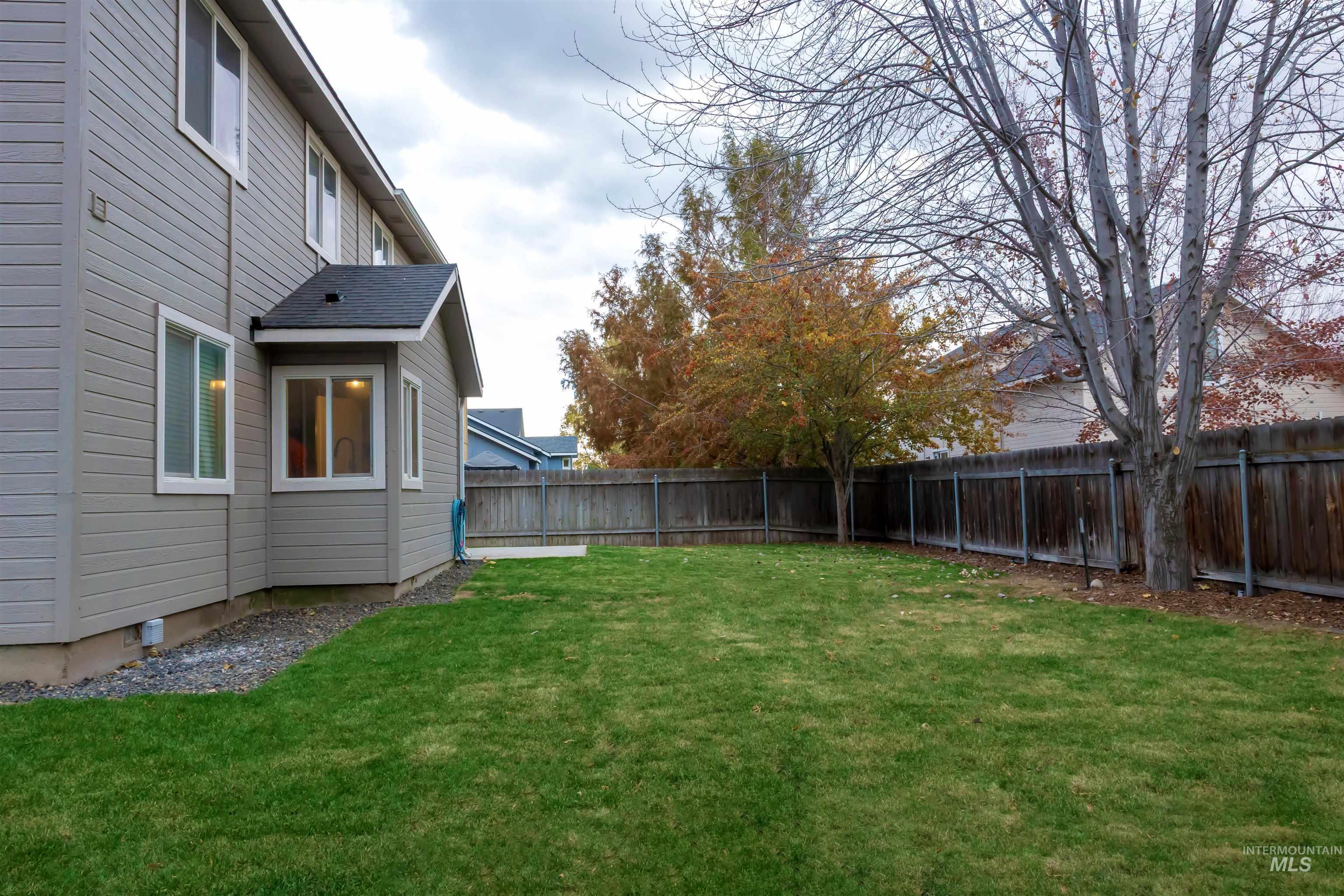View of fenced backyard