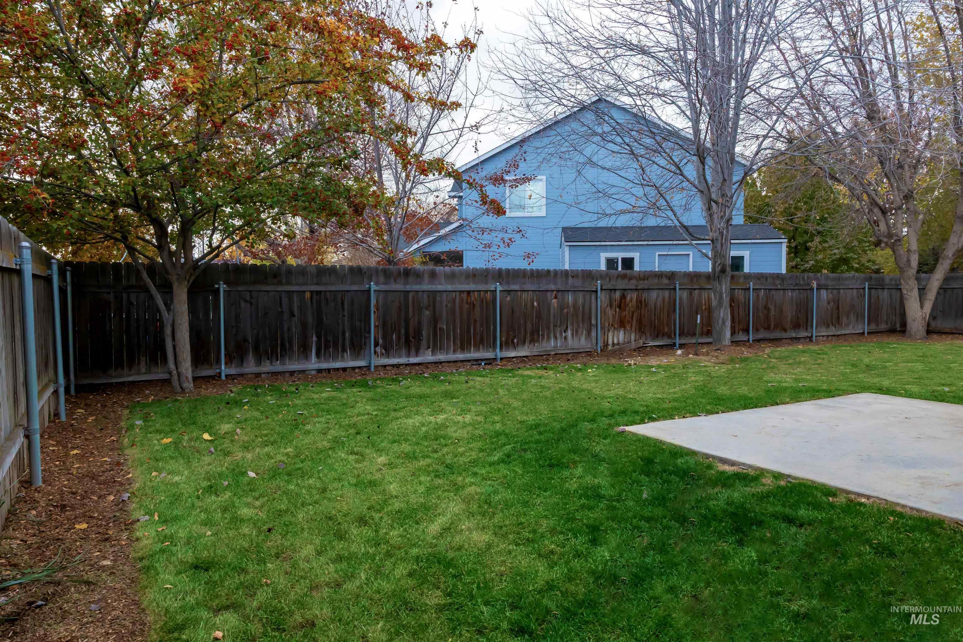 View of fenced backyard