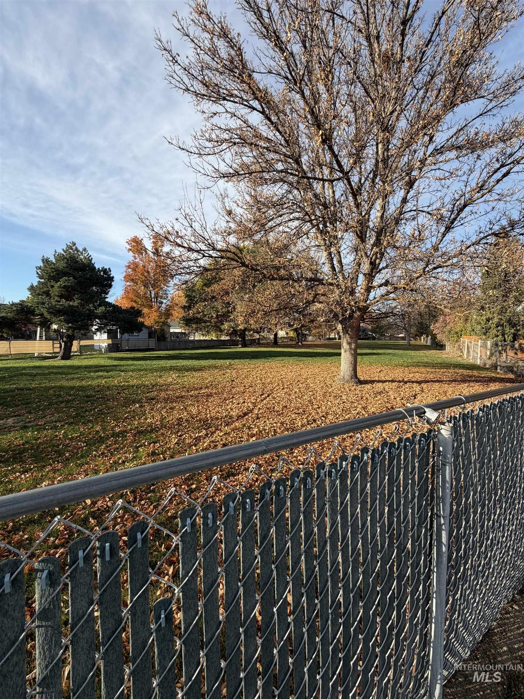 View of yard with a balcony