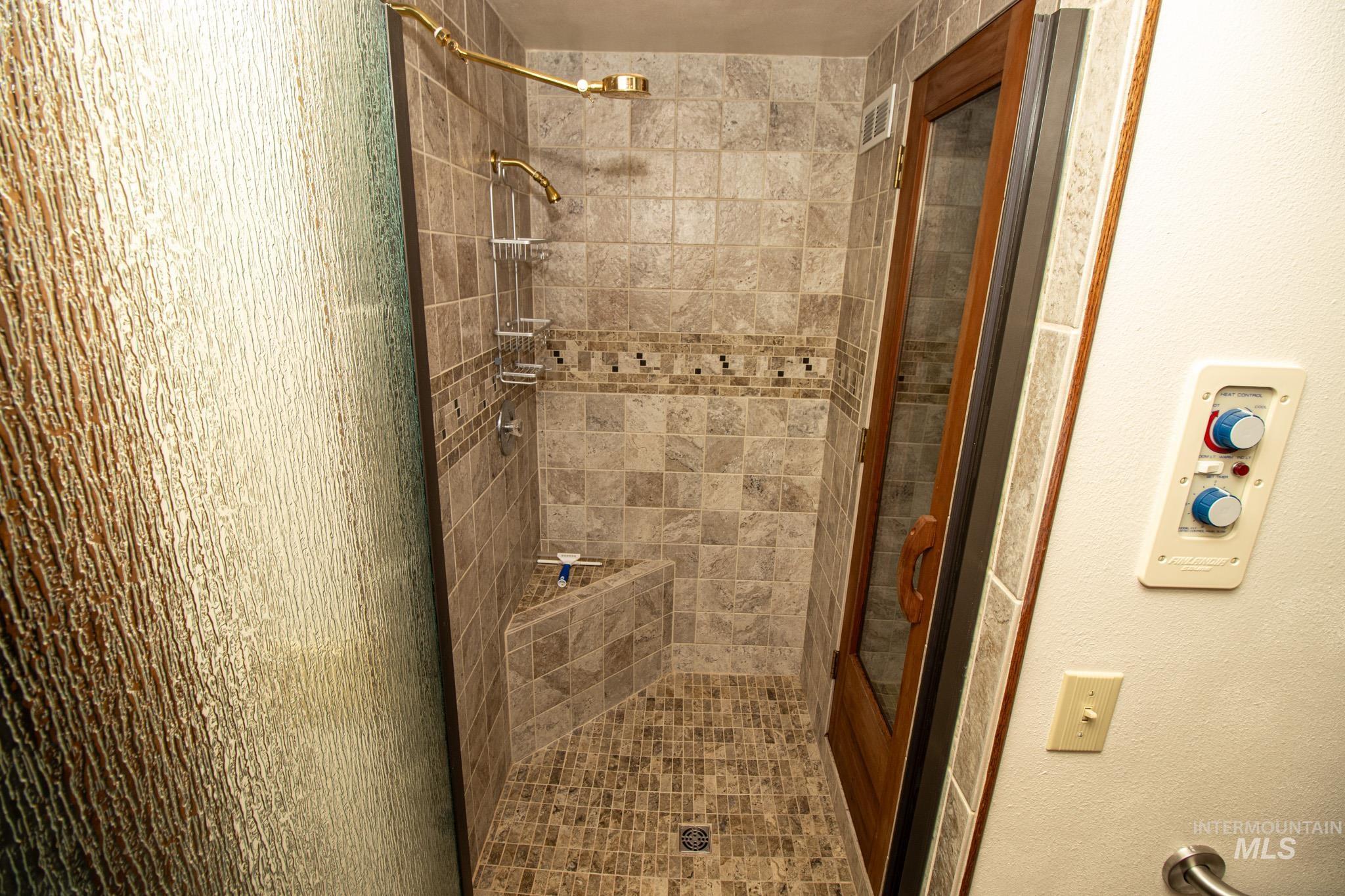 Full bath with a shower stall