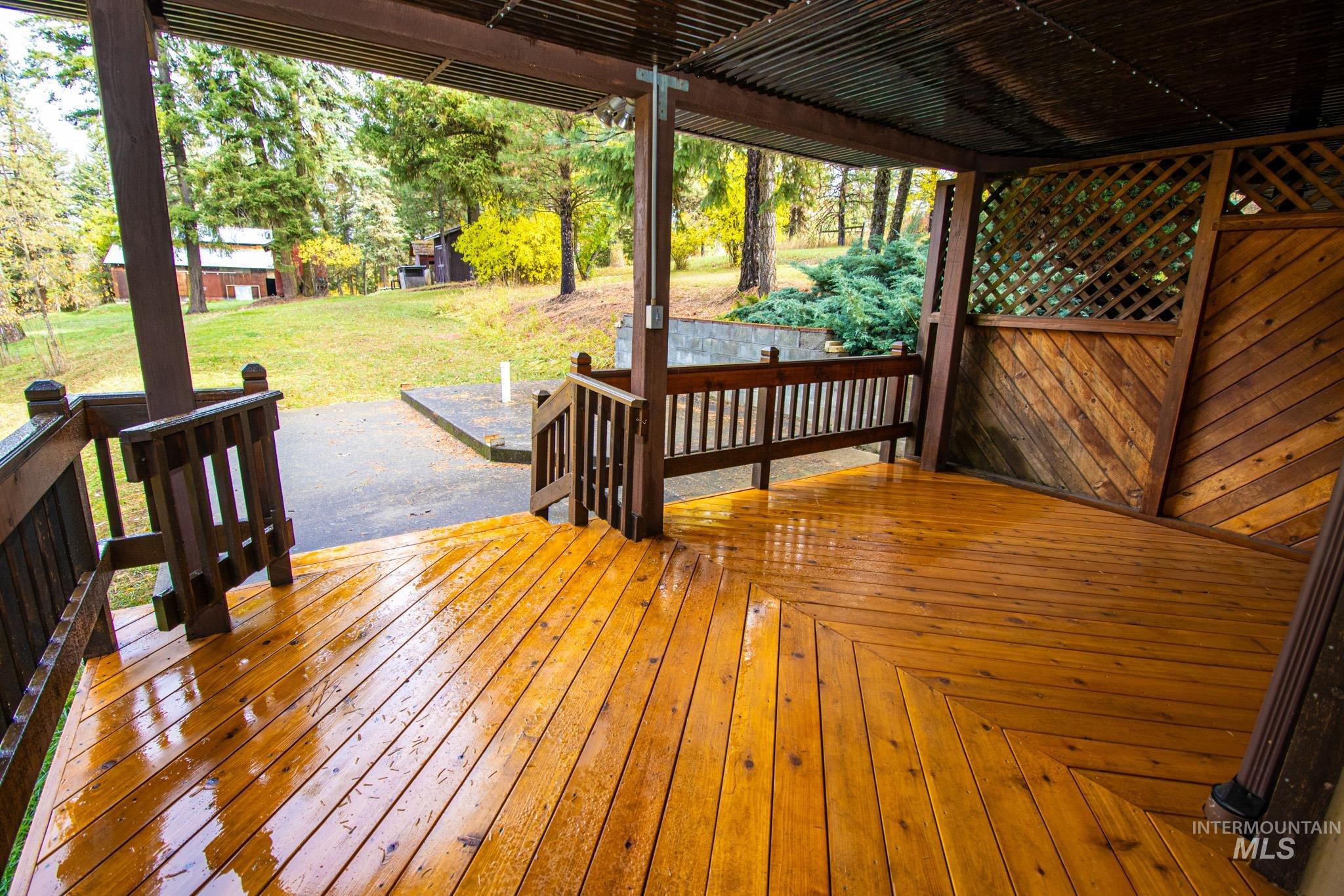 Wooden terrace with a lawn
