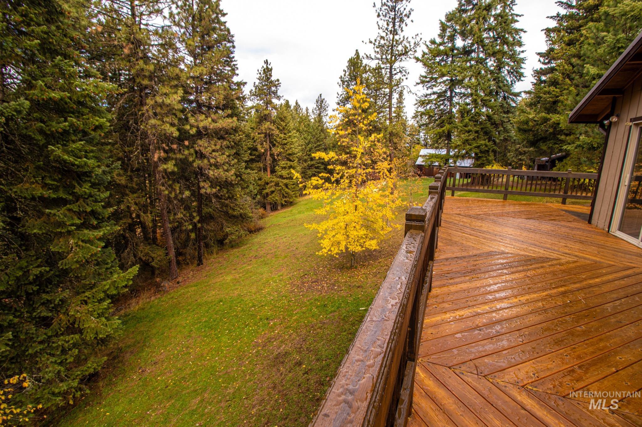 Wooden deck featuring a yard