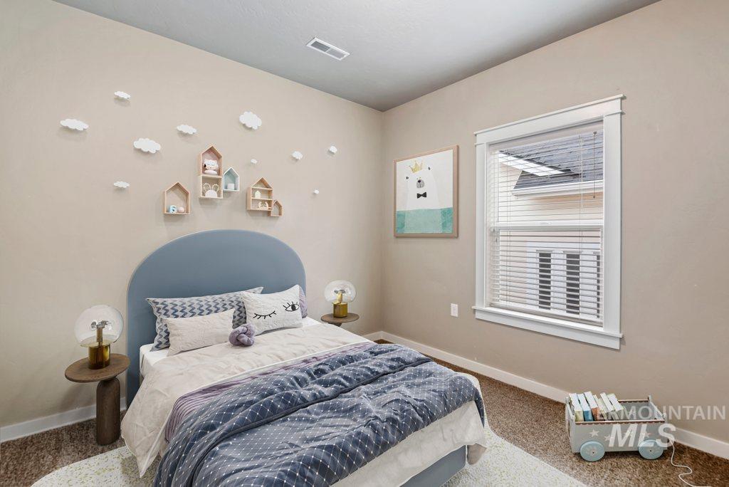 Carpeted bedroom with baseboards