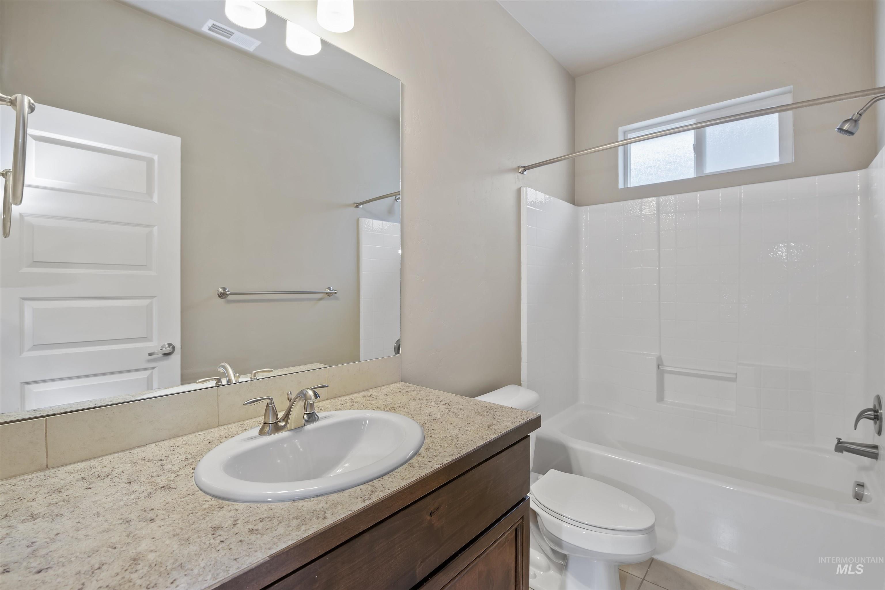 Full bathroom with tub / shower combination and vanity
