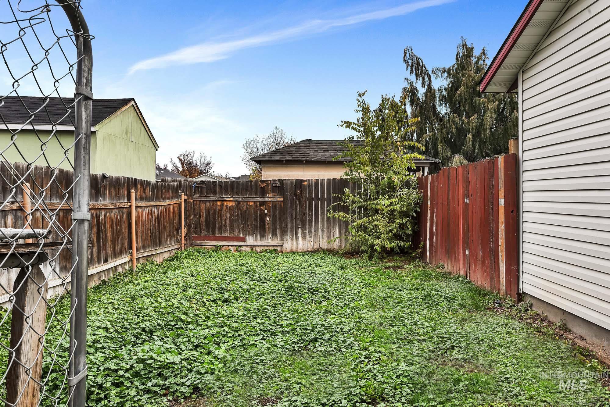 View of fenced backyard