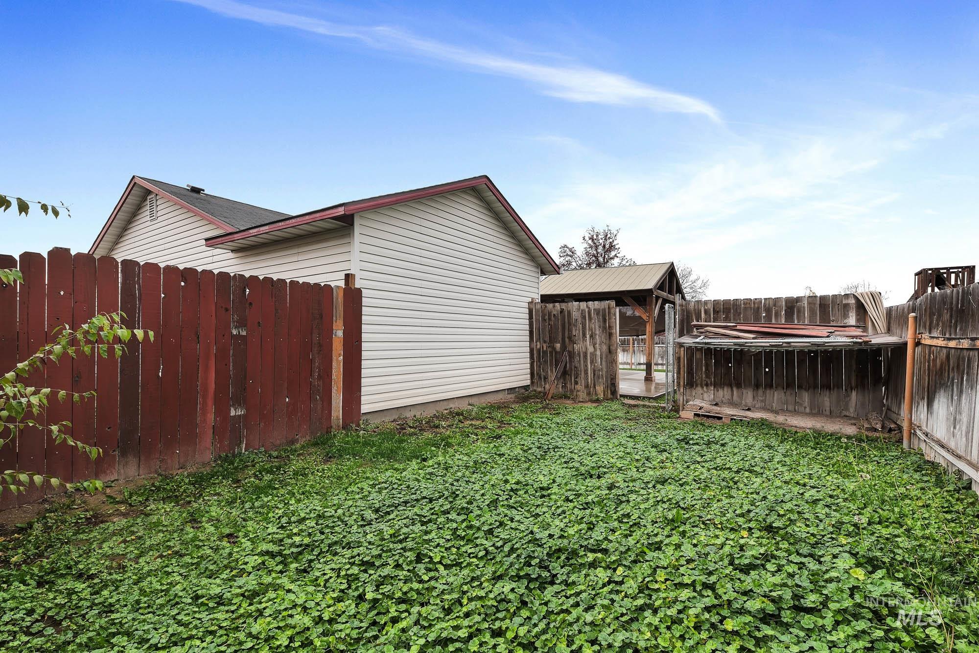View of fenced backyard
