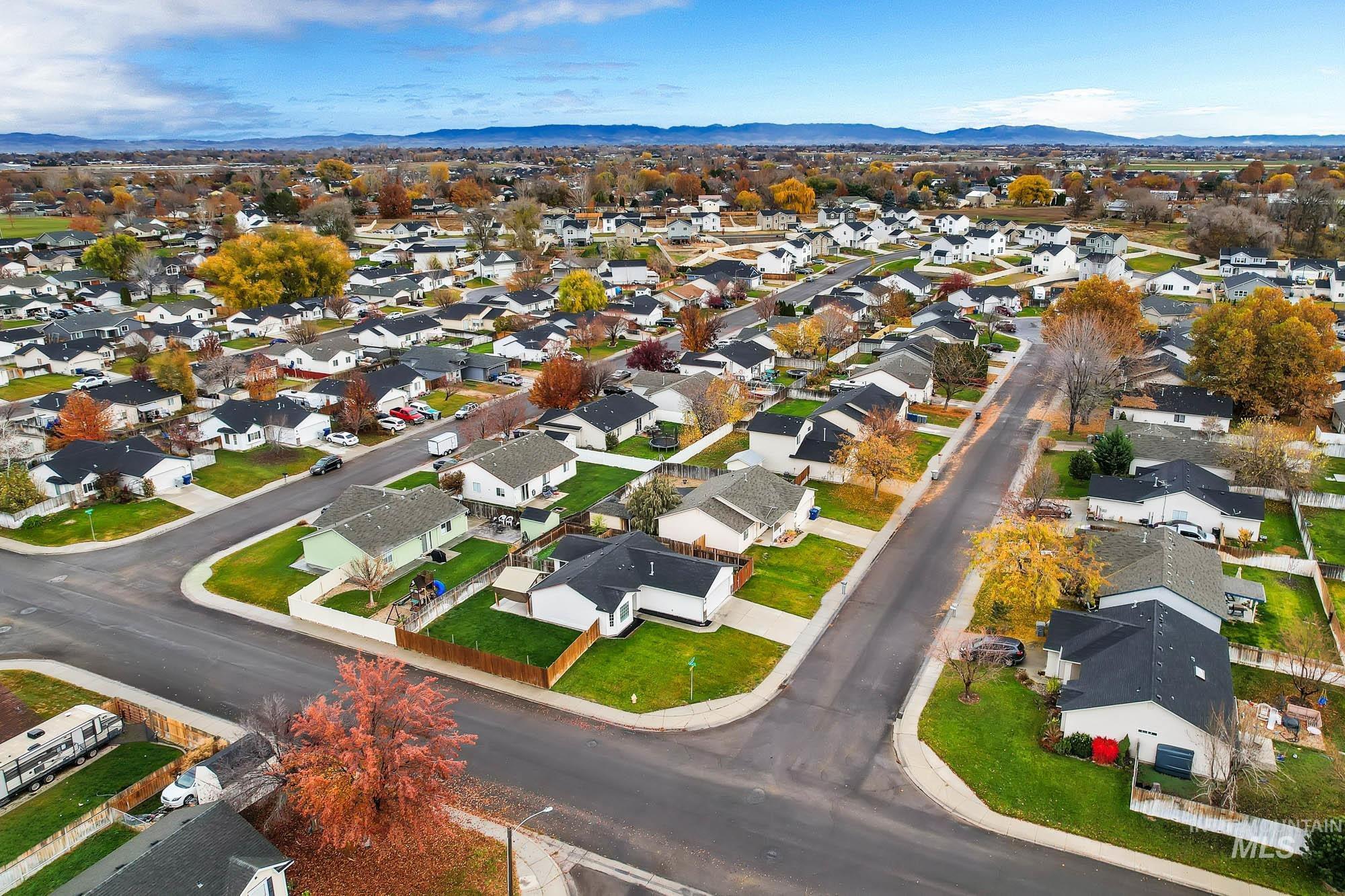 Aerial view of residential area with a mountainous background