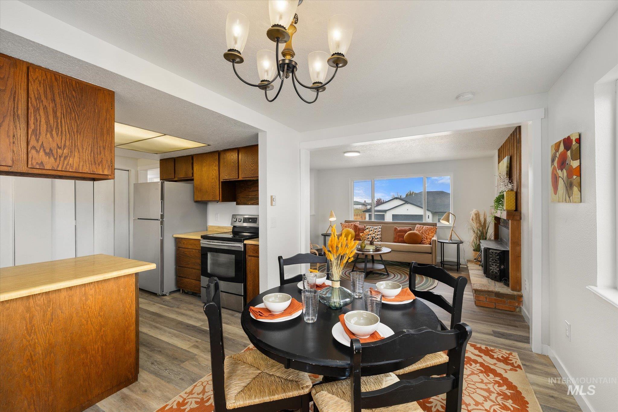 Dining room featuring a chandelier and dark wood-type flooring