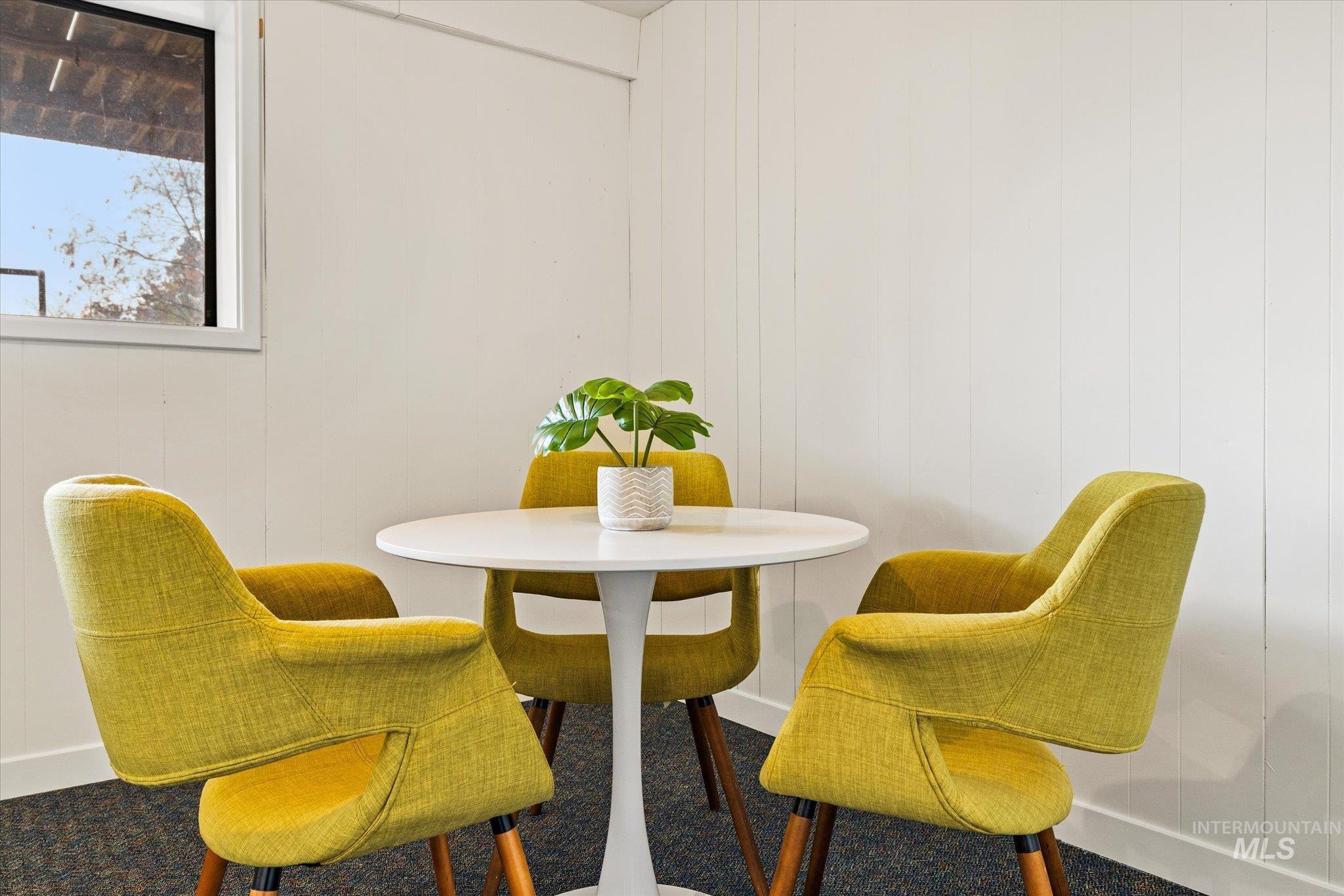 Dining space with wooden walls