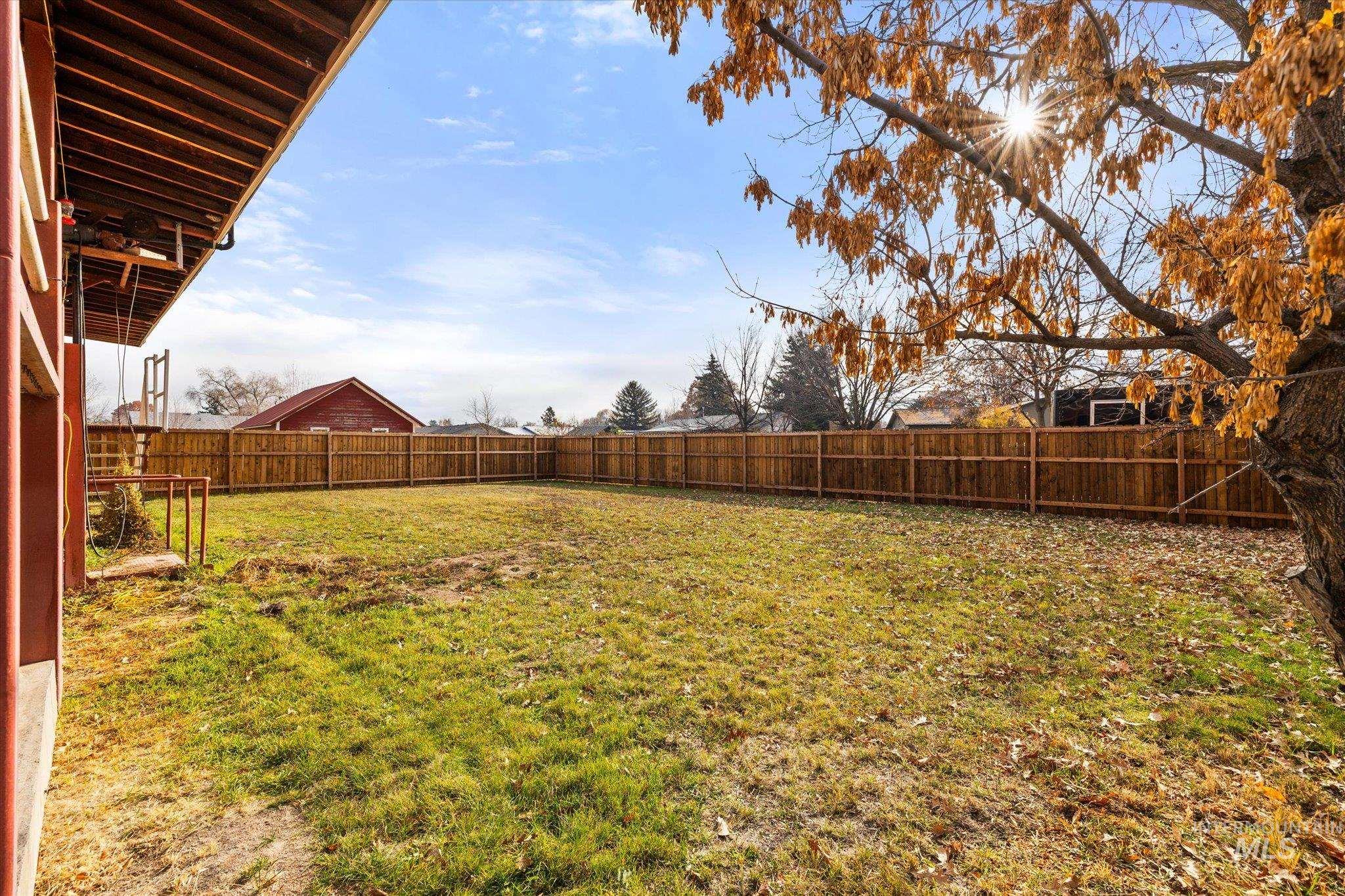 View of fenced backyard