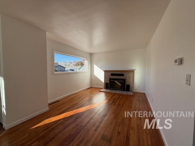 Spacious and bright living room with wood fireplace