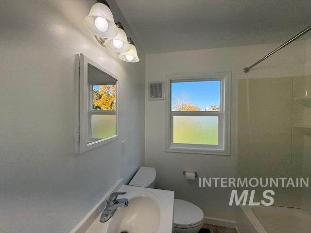 Full bath with vanity, plenty of natural light, and  shower combination