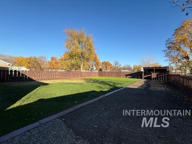 View of fenced backyard