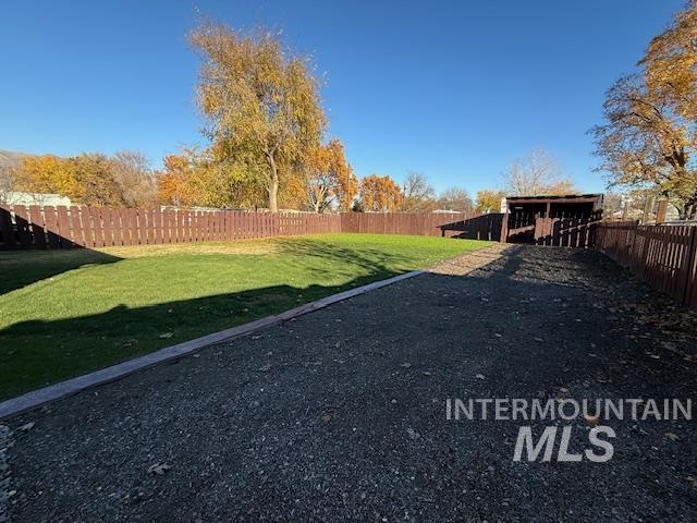 View of fenced backyard