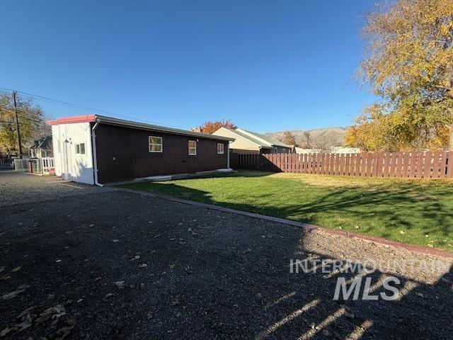 Rear view of house with spacious back yard