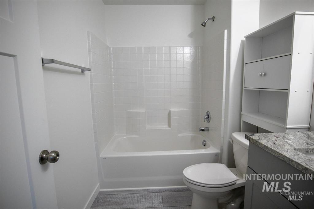 Bathroom featuring vanity and shower / tub combination