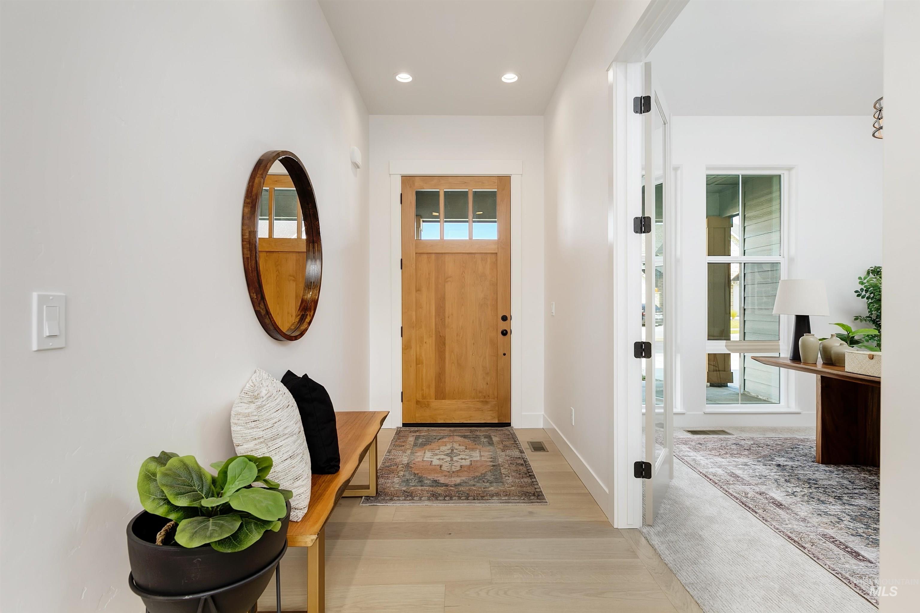 Foyer featuring recessed lighting and wood finished floors