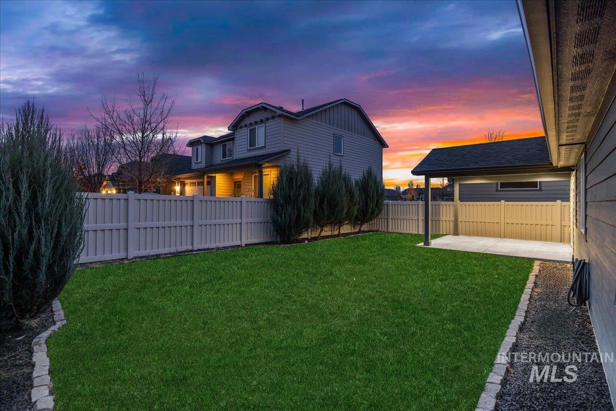 View of fenced backyard
