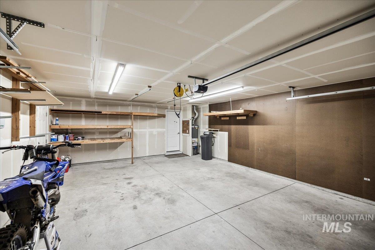 Garage featuring a garage door opener