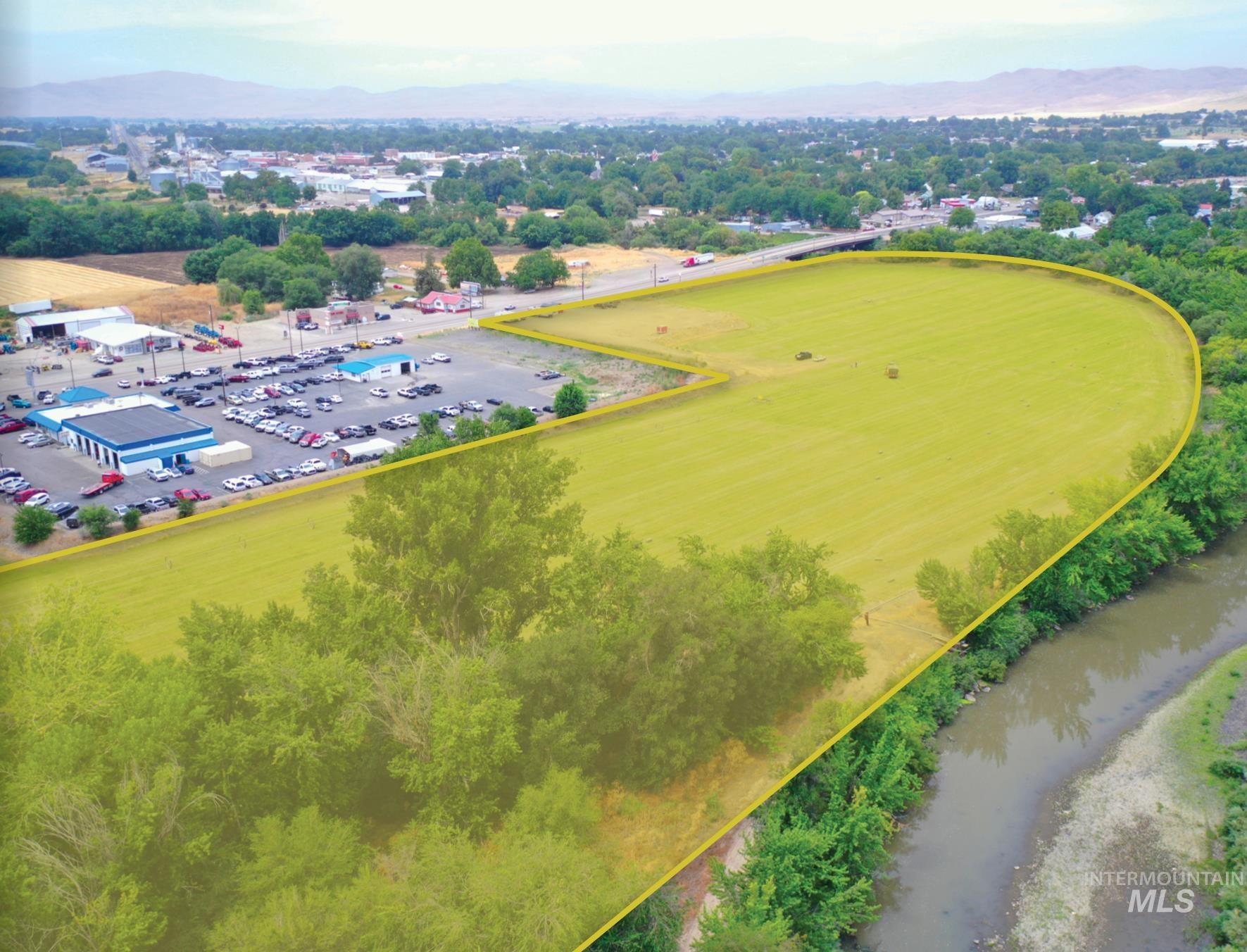 Aerial view of property and surrounding area with a tree filled landscape and property boundaries highlighted