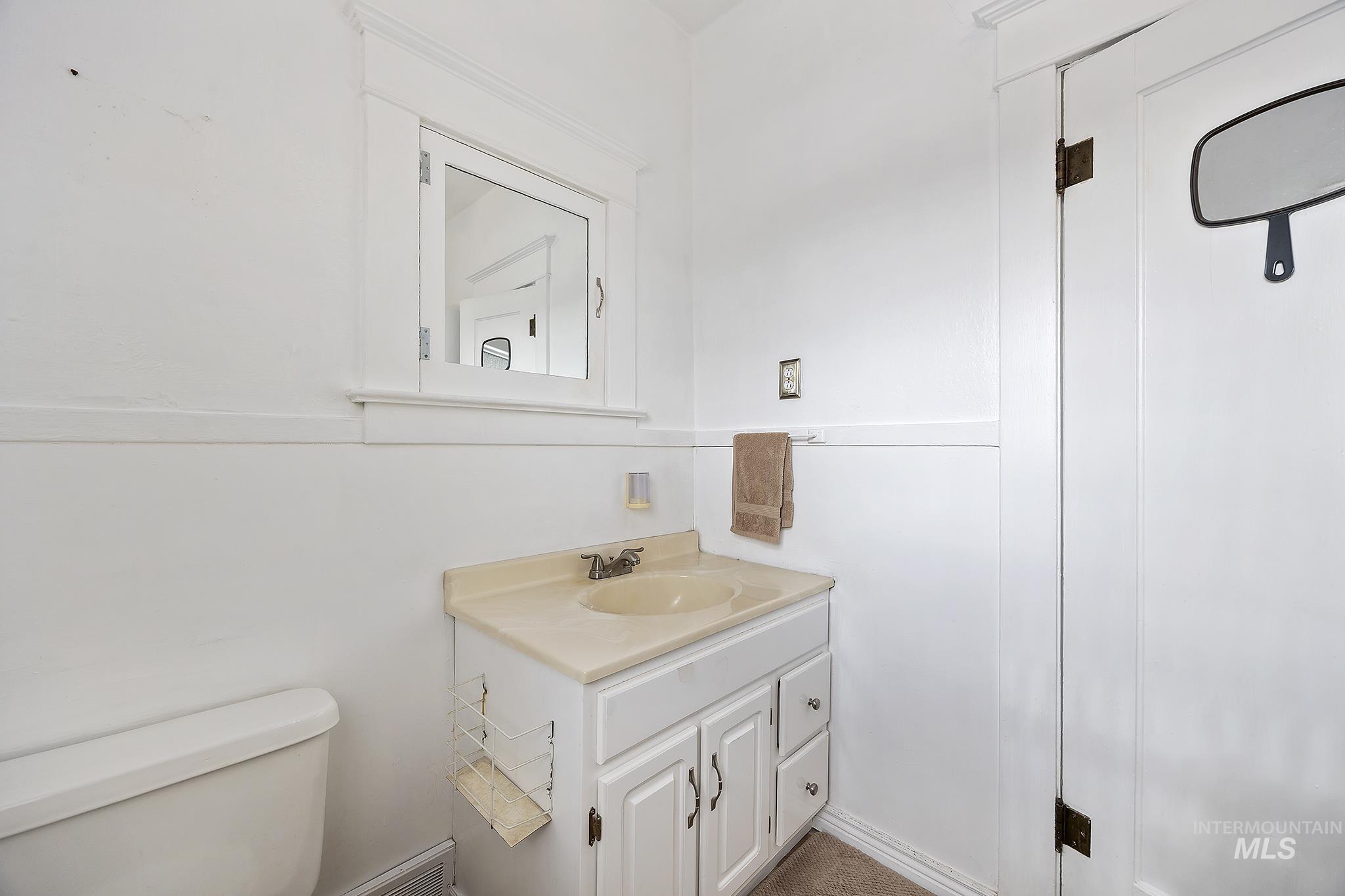 Bathroom with vanity and toilet