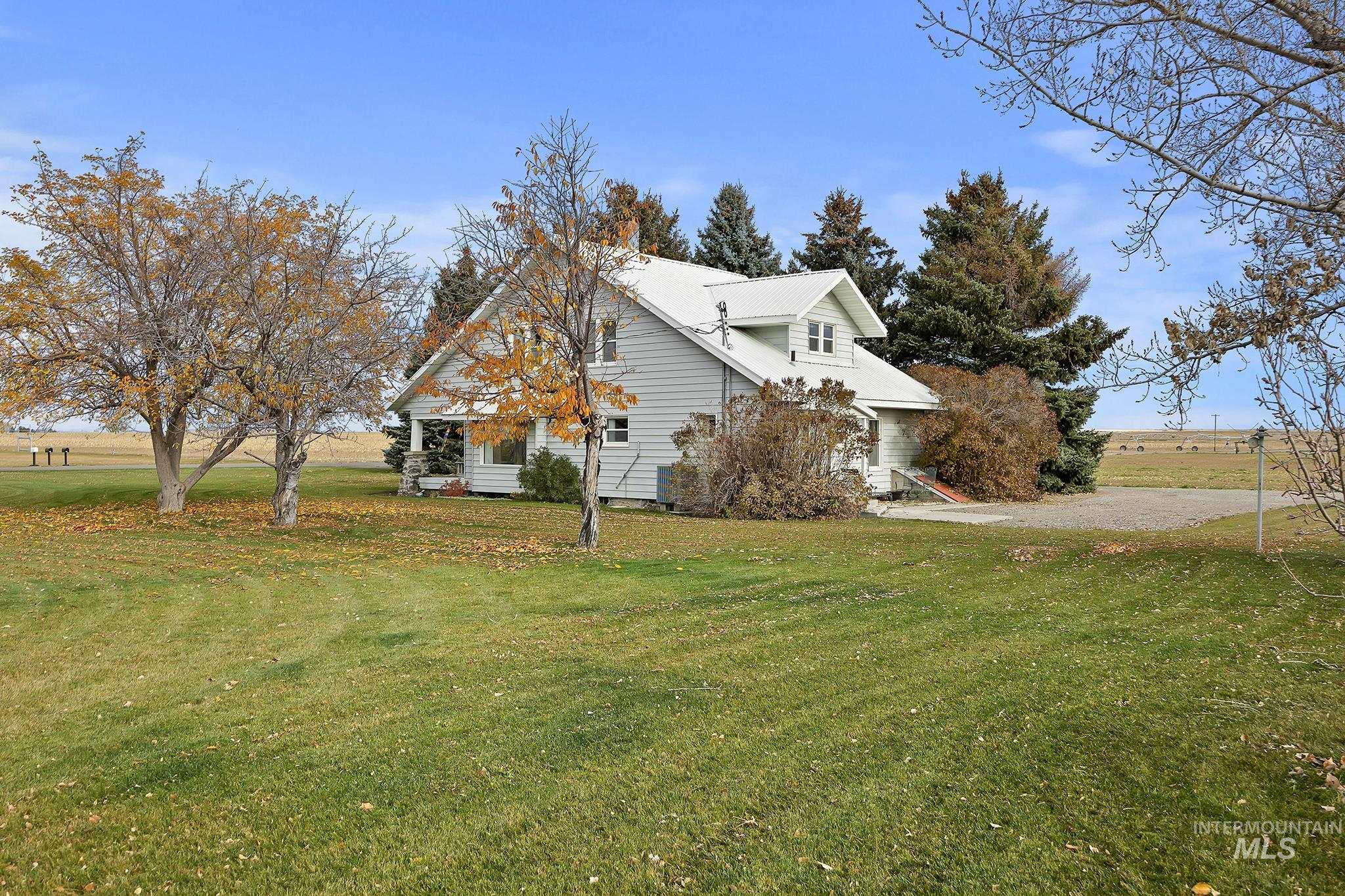 View of side of property with a yard