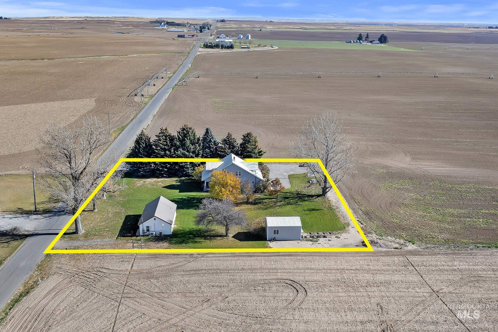 Aerial view of sparsely populated area with property boundaries highlighted