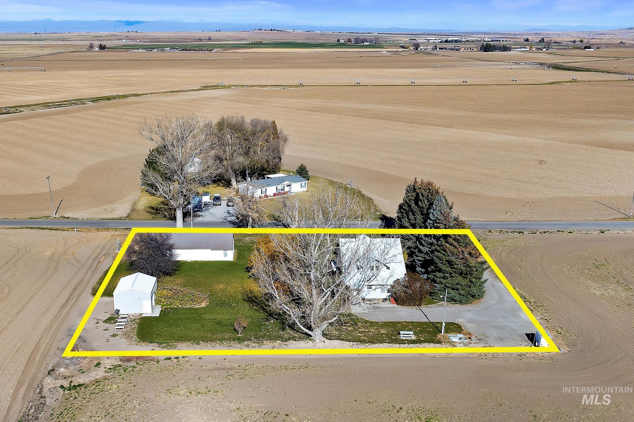 Aerial view of sparsely populated area featuring property boundaries highlighted