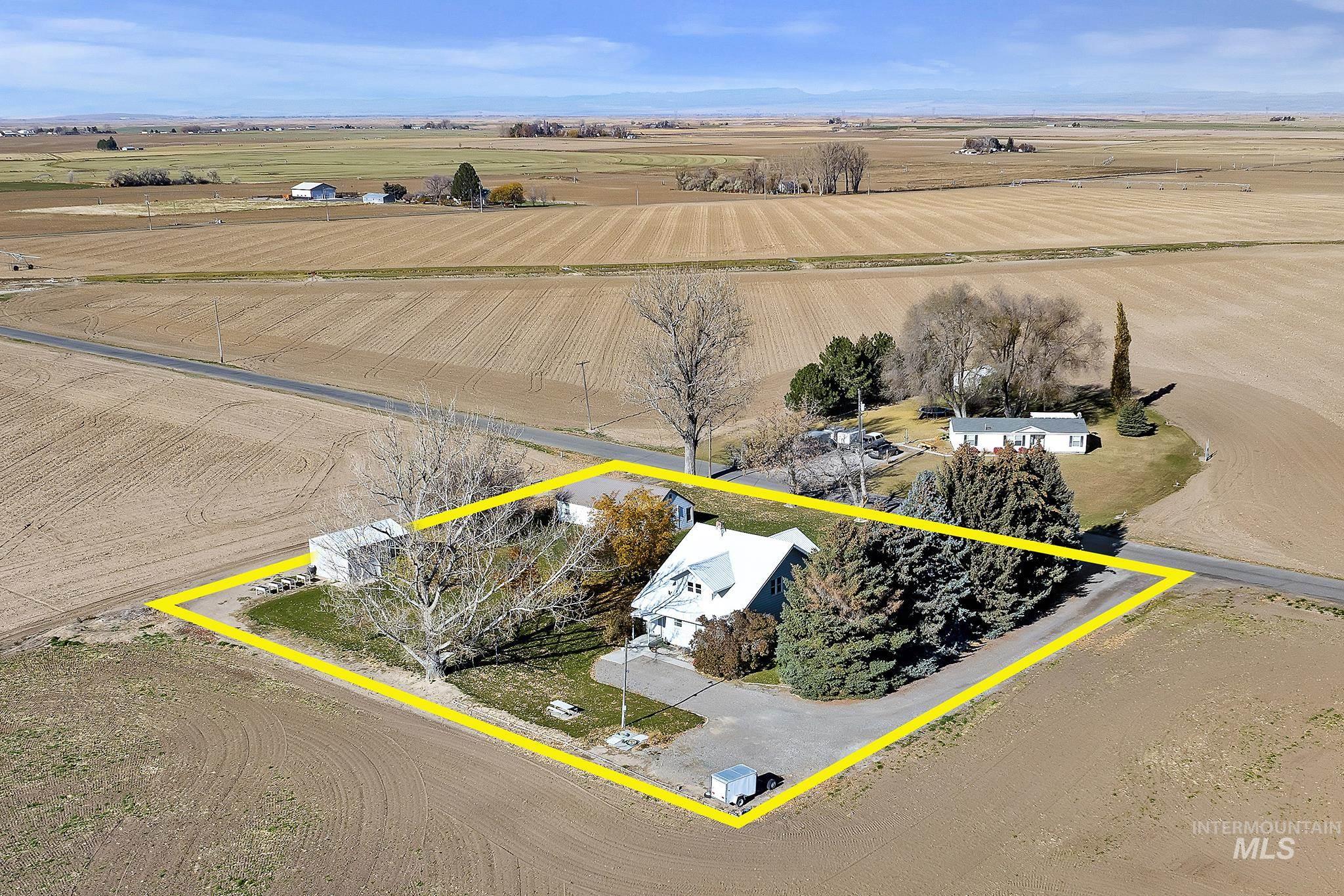 Overview of rural landscape featuring property boundaries highlighted and extensive farmland