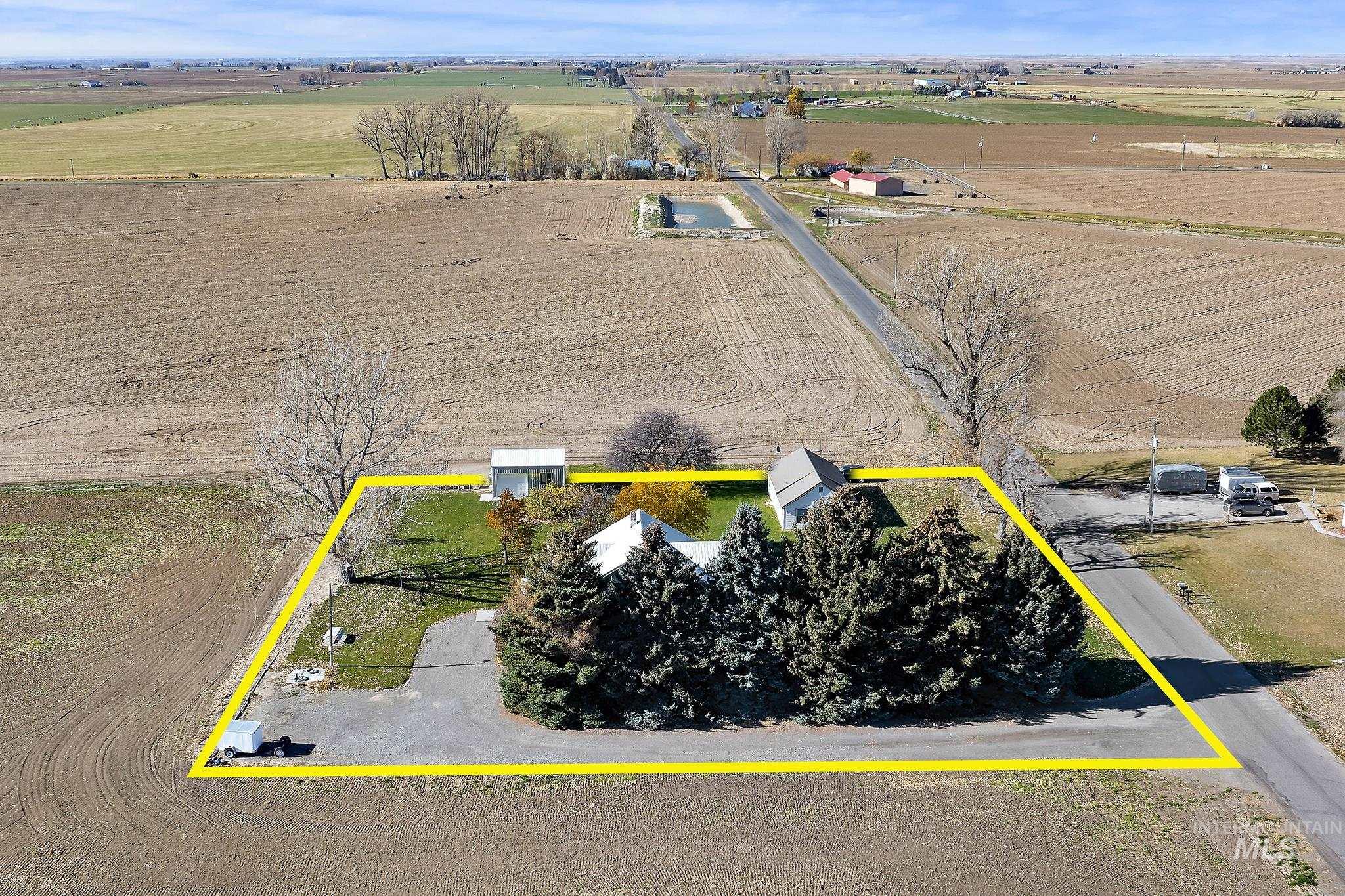 View of rural area featuring property parcel outlined and extensive farmland