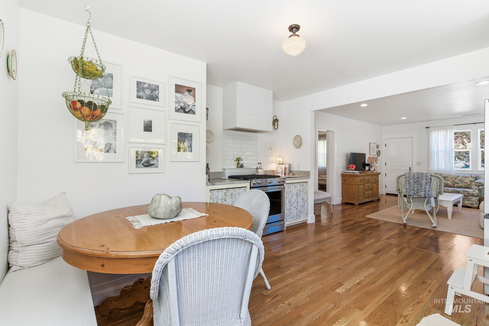 Dining space featuring light wood-style floors and baseboards