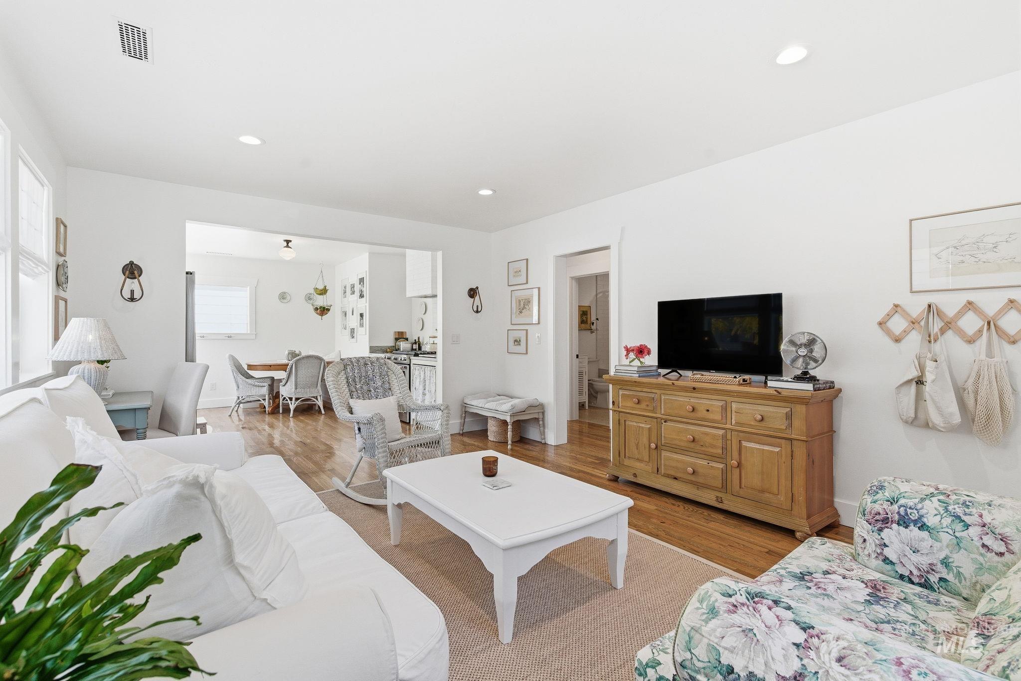 Living room featuring recessed lighting and light wood-style flooring