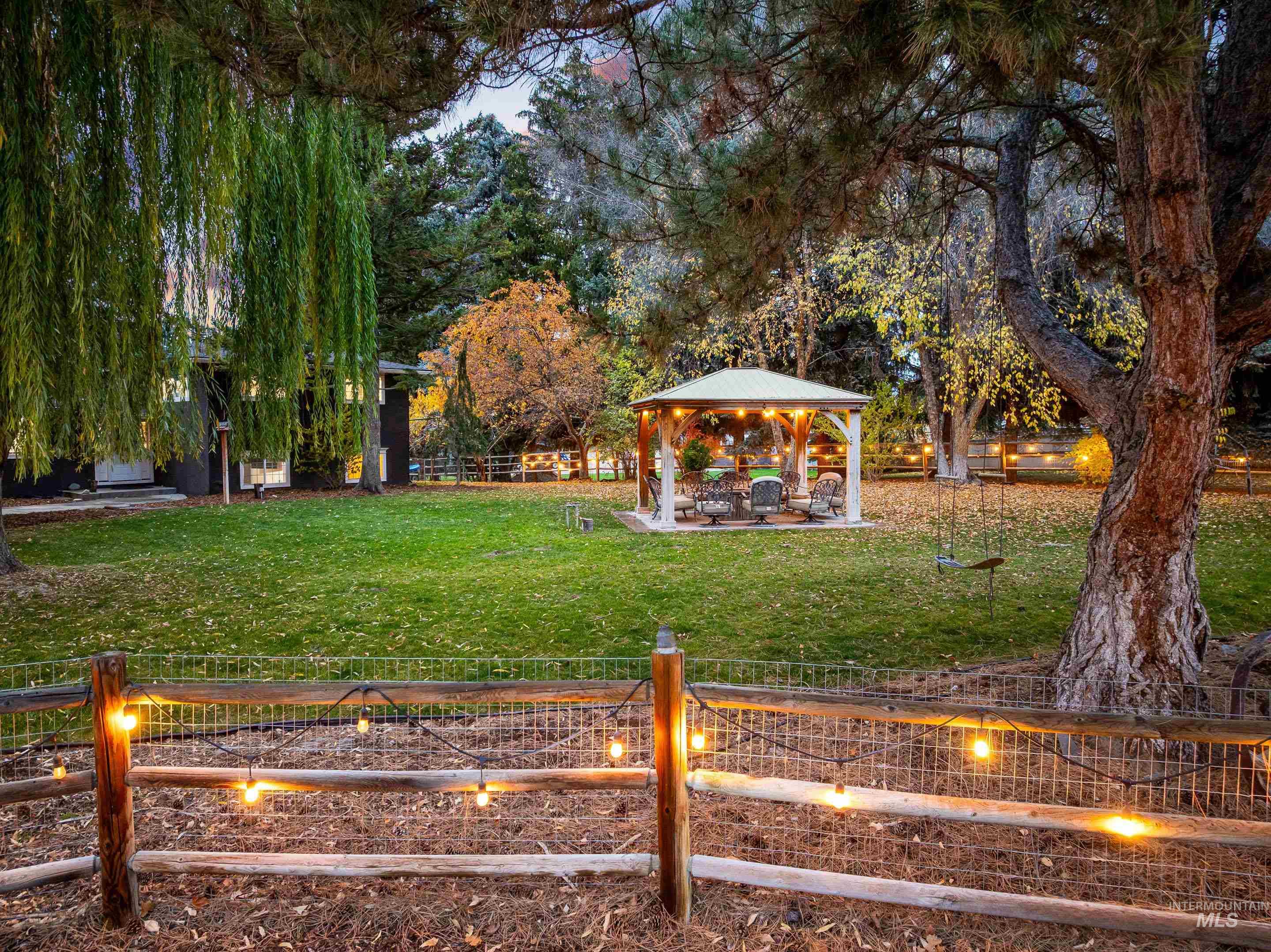 View of yard with a gazebo and a patio area