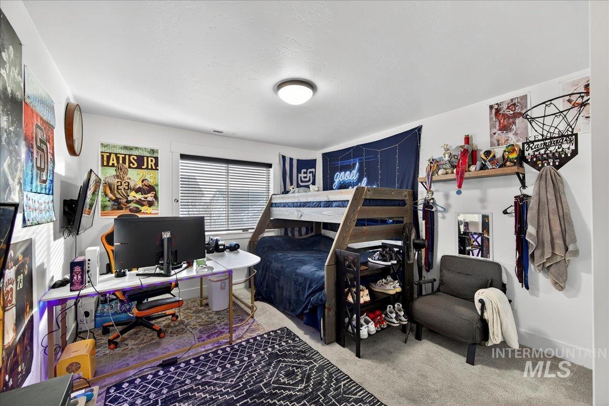 Bedroom featuring carpet floors