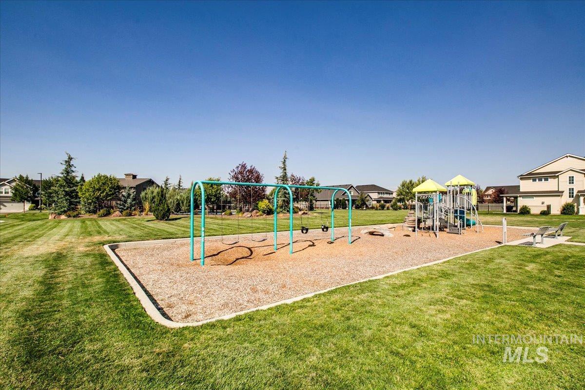 Community playground featuring a lawn