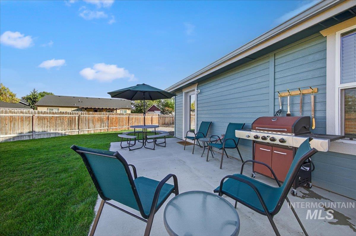Fenced backyard featuring a patio