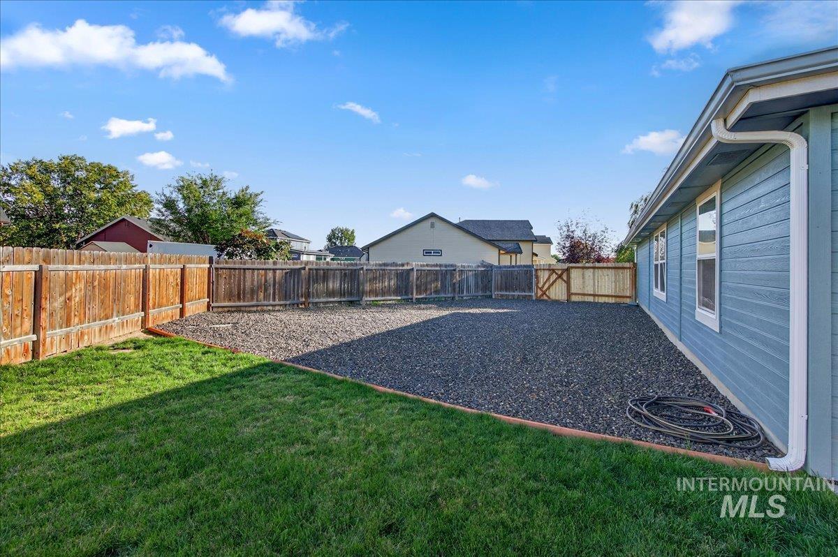 View of fenced backyard
