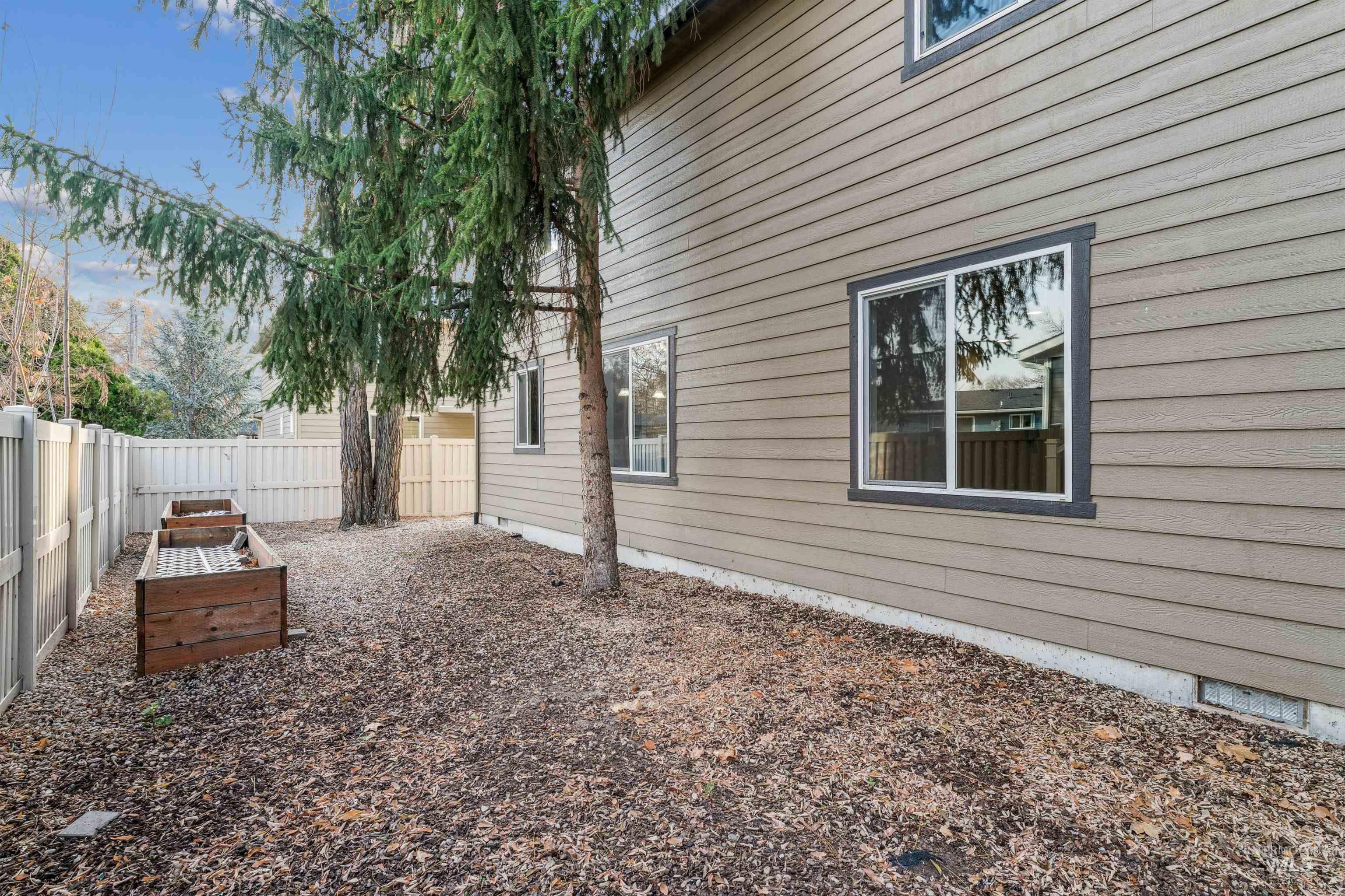 View of fenced backyard