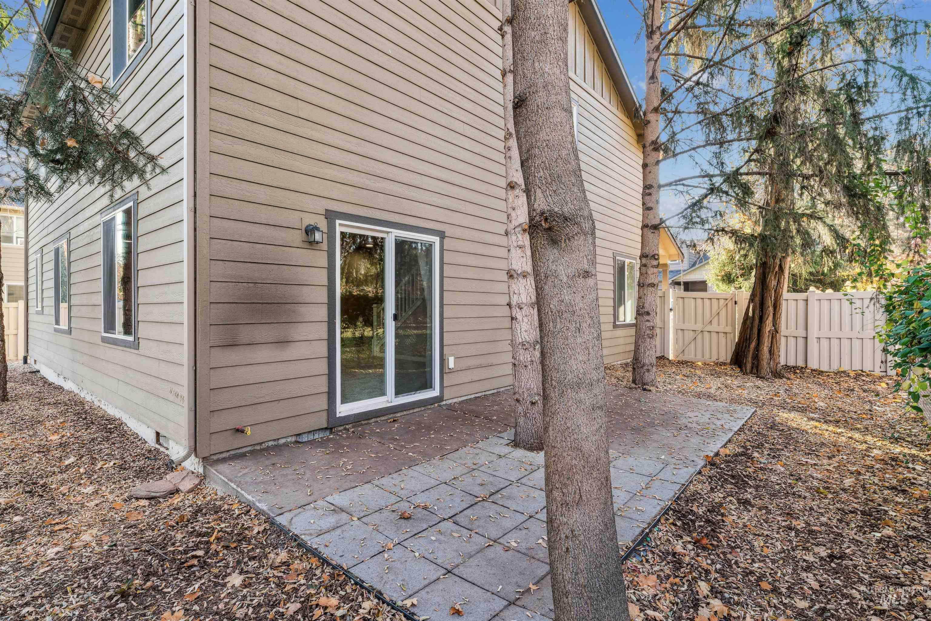 Back of house featuring a patio and crawl space