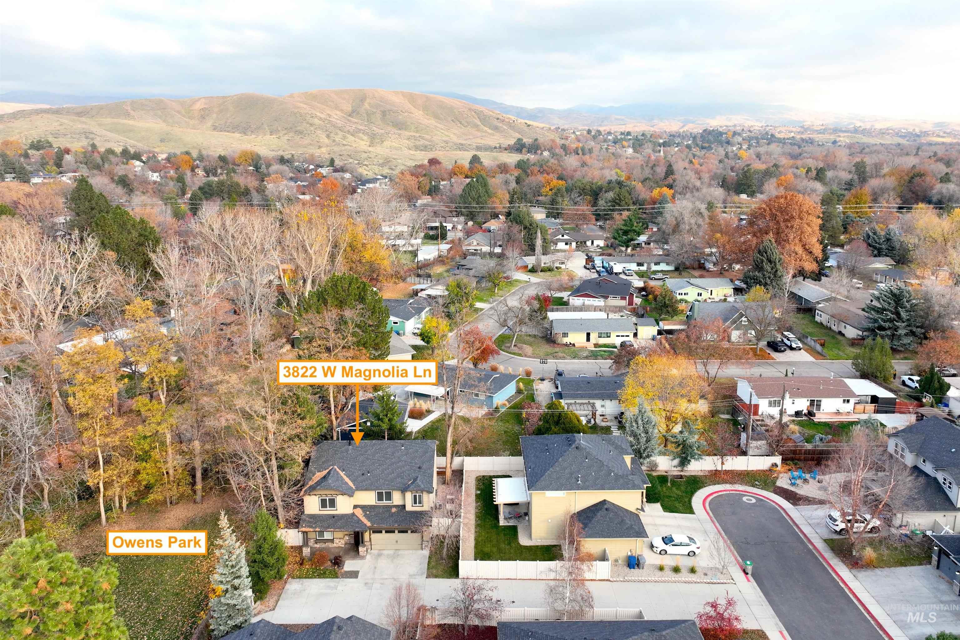 Aerial view of residential area featuring a mountain backdrop