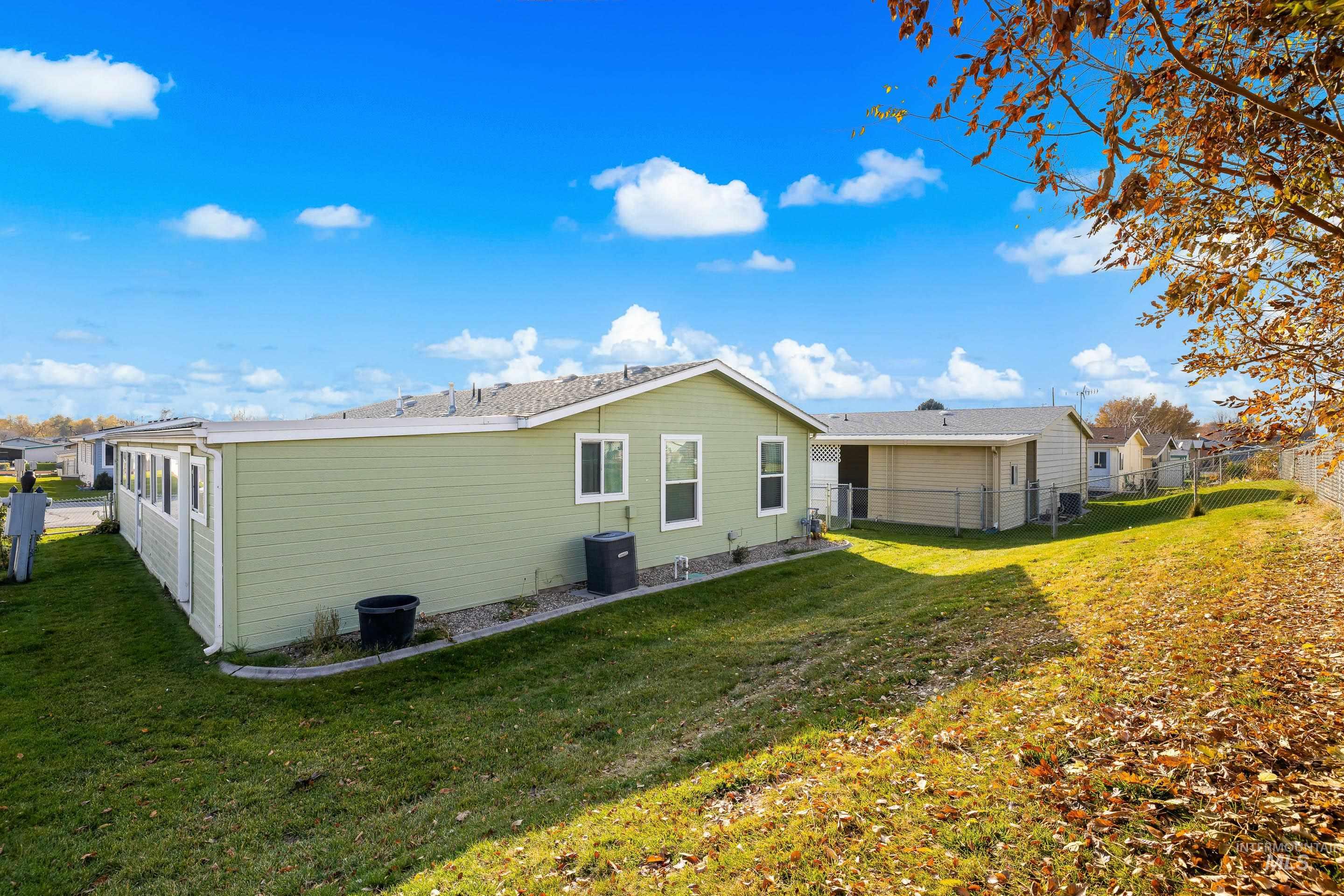 Back of property featuring a fenced backyard
