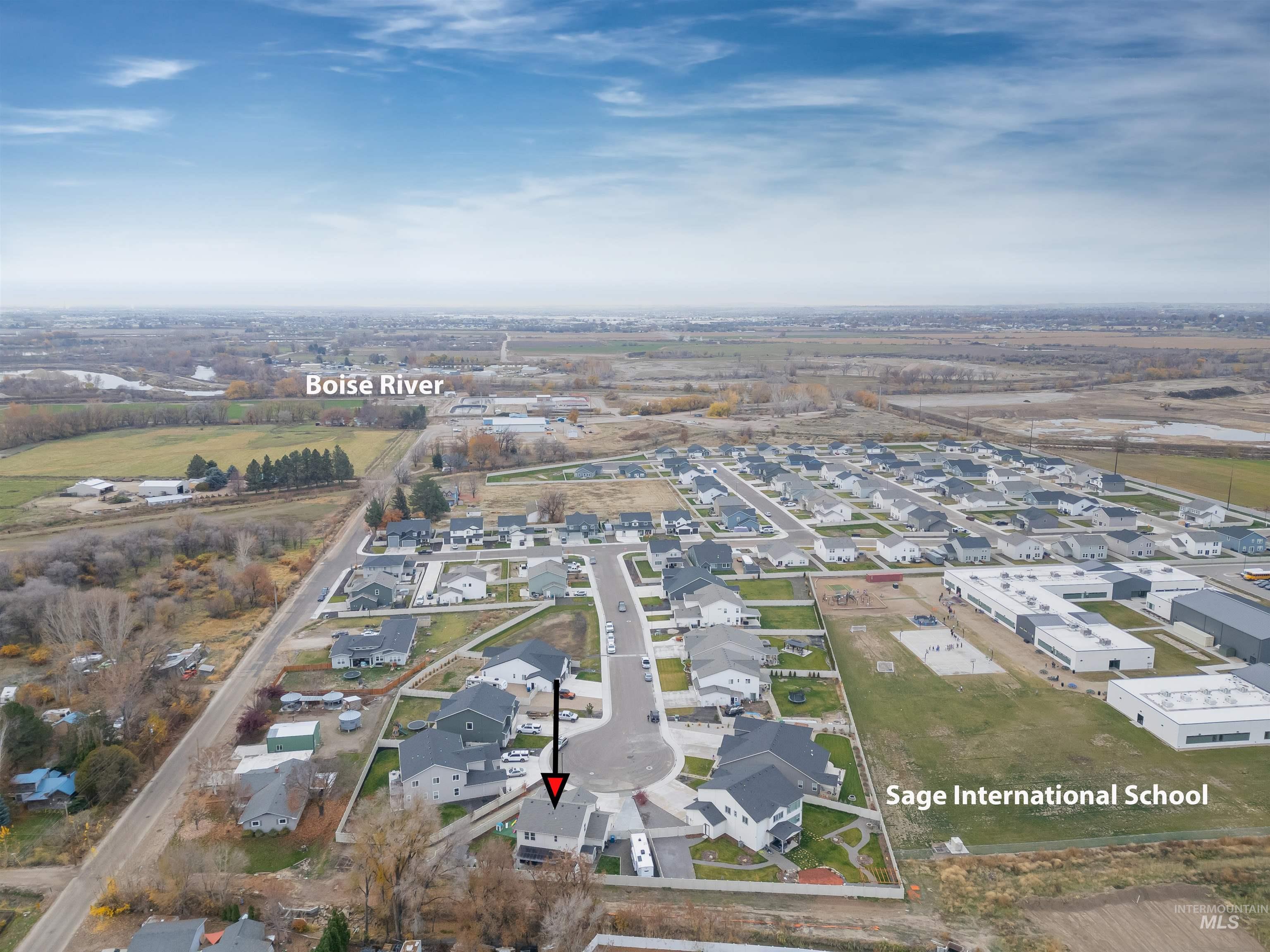 Aerial overview of property's location with nearby suburban area