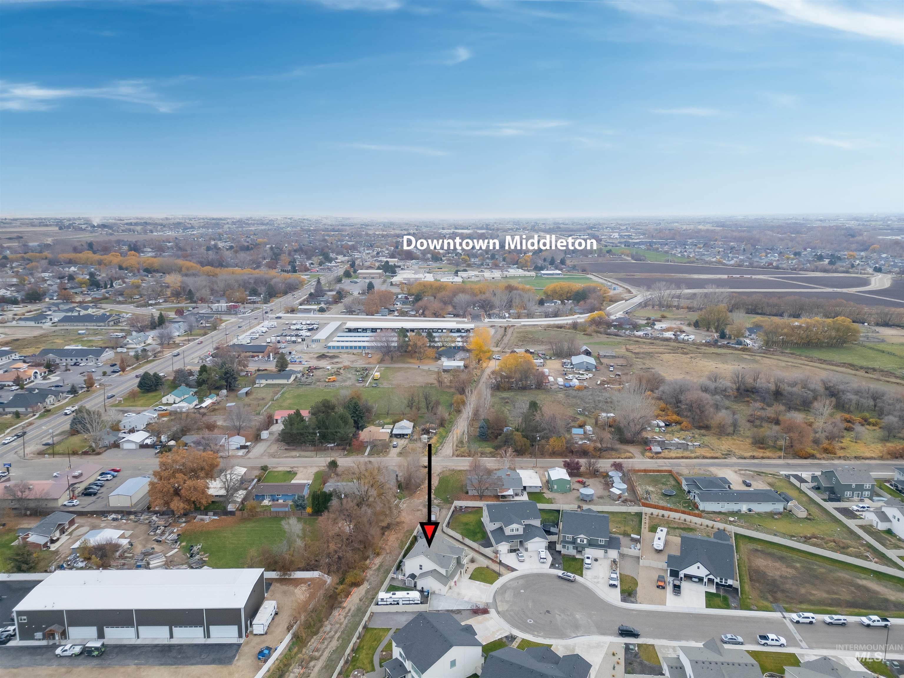Aerial view of property's location featuring nearby suburban area