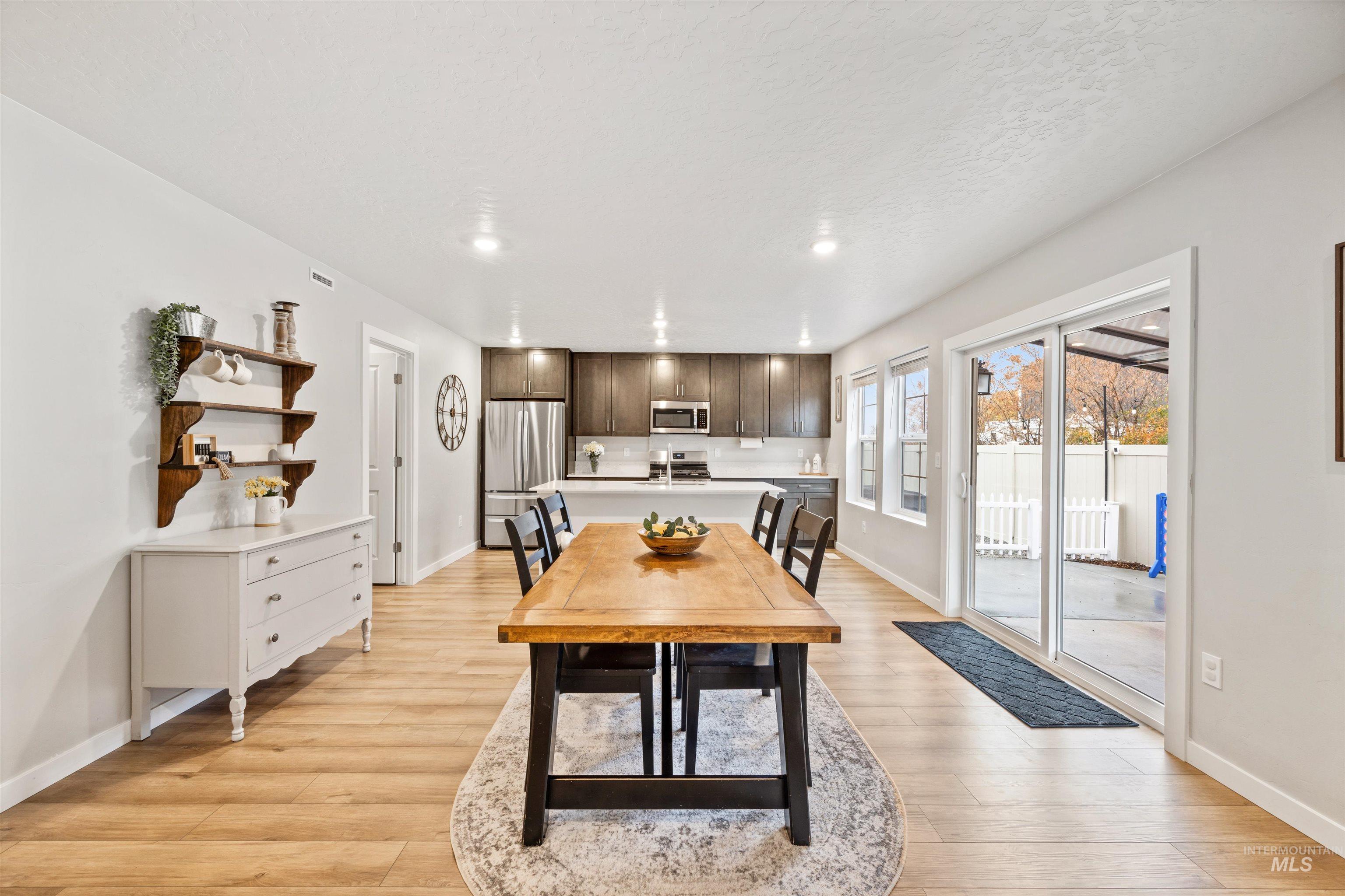 Dining space featuring recessed lighting and light wood-style floors